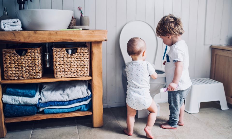 Children playing in toilet